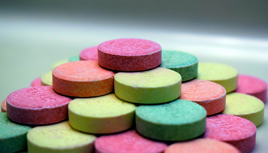 Colorful Chewable Tablets Stacked In A Pyramid Shape