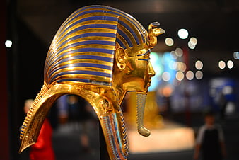Golden Egyptian Pharaoh Mask in Museum Display