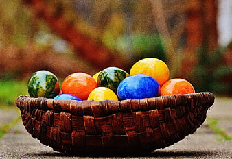 Colorful Easter Eggs in Woven Basket