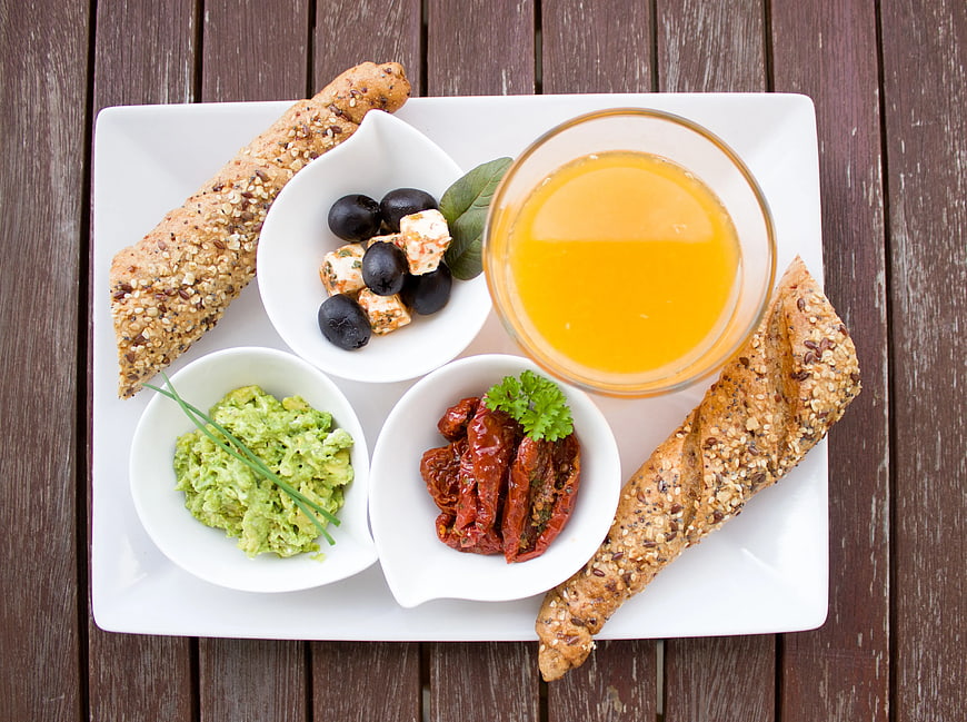 Healthy Breakfast Platter with Bread, Juice, and Dips