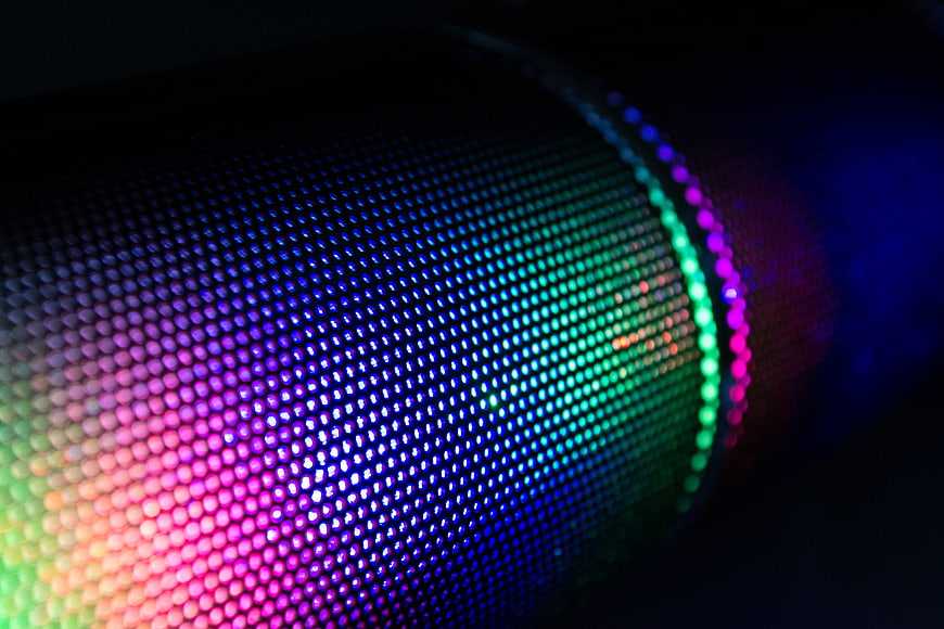 Close-up of colorful LED speaker grille with rainbow lights