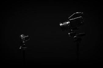 Cinematic Camera and Vintage Camera on Black Background
