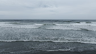 Gray Ocean Waves Rolling on Overcast Day