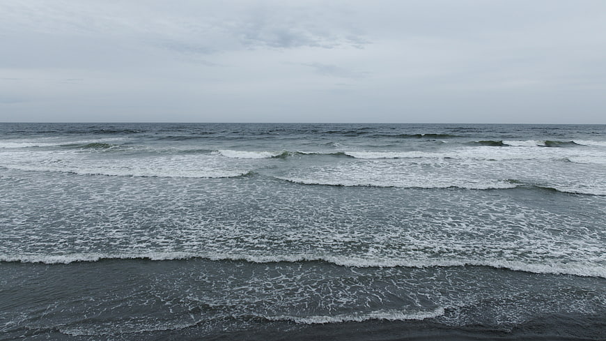 Gray Ocean Waves Rolling on Overcast Day