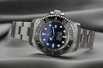 Close-up of a luxury Rolex Deepsea watch with blue dial