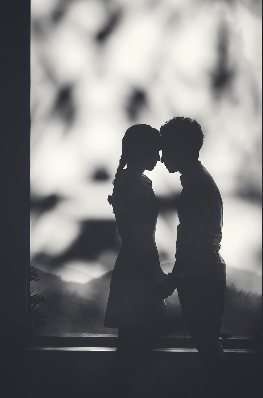 Romantic Black and White Silhouette of Couple Foreheads Touching
