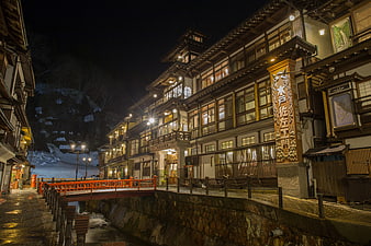 Traditional Japanese Ryokan Street at Night with Snow