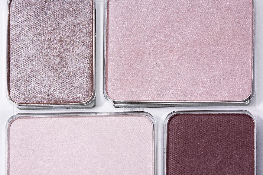 Close-up of pink and mauve eyeshadow palette with shimmer and matte finishes