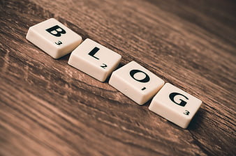 Scrabble Tiles Spelling Blog on Wooden Table