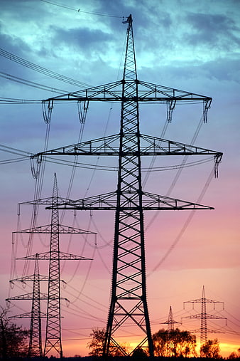 Silhouette of High Voltage Power Lines at Sunset