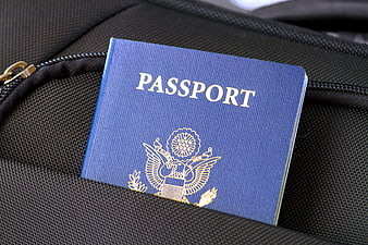 Blue US Passport on Black Travel Bag