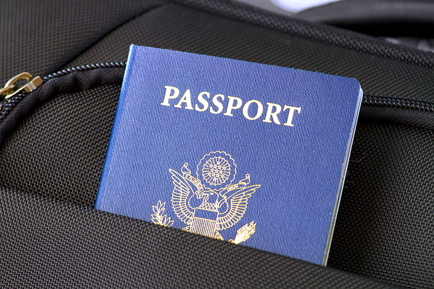 Blue US Passport on Black Travel Bag
