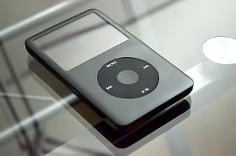 Gray iPod Classic on Reflective Surface