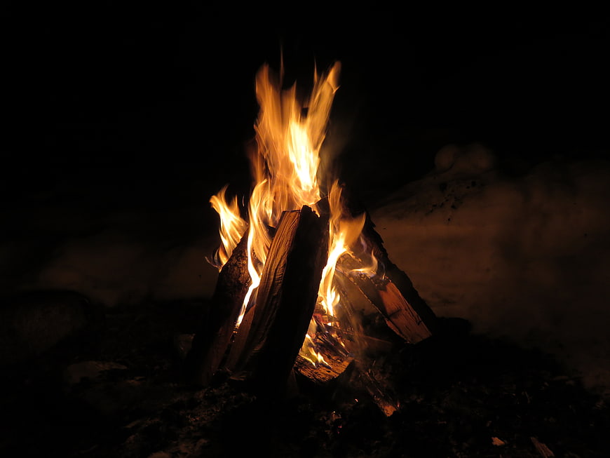 Campfire Burning Brightly Against Dark Night Sky