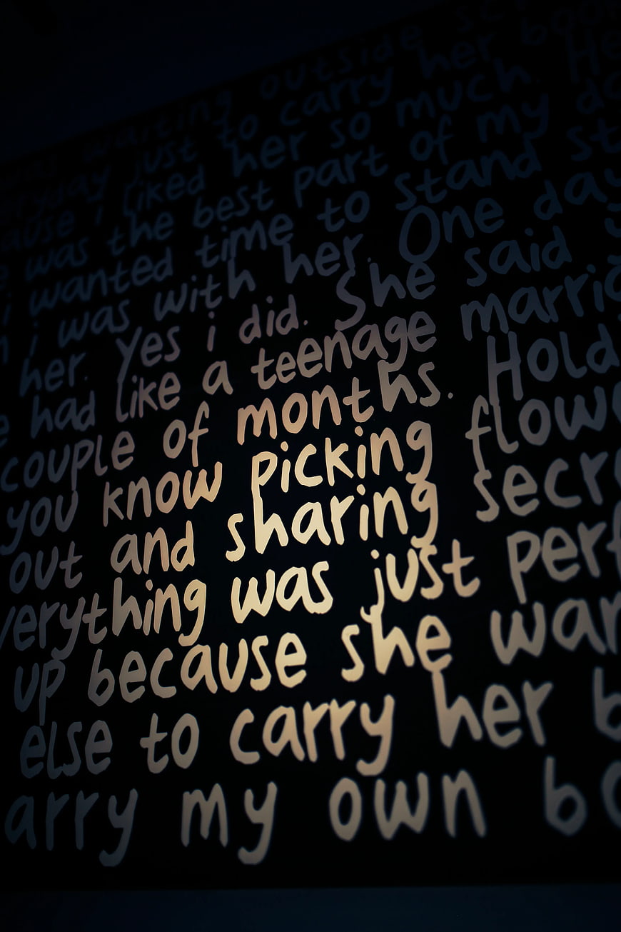 Close-up of handwritten text on dark background