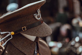 Close-up of vintage military cap with metal insignia