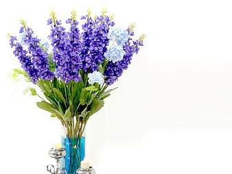 Purple and Blue Flower Bouquet in Blue Vase with Candles