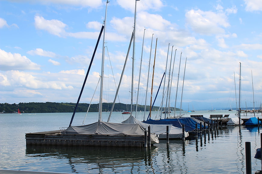 Sailboats docked at a marina on a sunny day