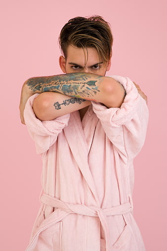 Man in Pink Bathrobe with Tattoos on Pink Background