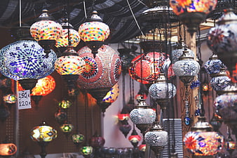 Colorful Turkish mosaic lanterns hanging in a market shop
