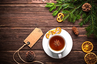 Festive Tea with Pretzels and Pine Branches on Wood