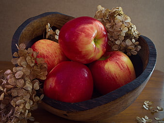 Fresh Red Apples in Rustic Wooden Bowl with Dried Flowers
