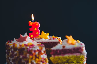 Colorful Birthday Cake With Number Three Candle And Sprinkles