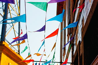 Colorful Festival Pennants Hanging Against Sky