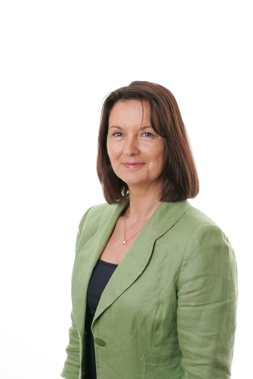 Professional Portrait of Confident Businesswoman in Green Blazer