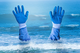 Blue Gloved Hands Reaching Up From Ocean Waves