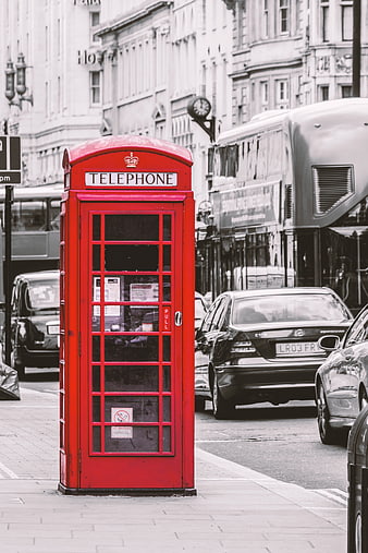 Red Telephone Box on London Street with Black and White Background