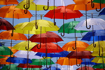Colorful Hanging Umbrellas Against Blue Sky