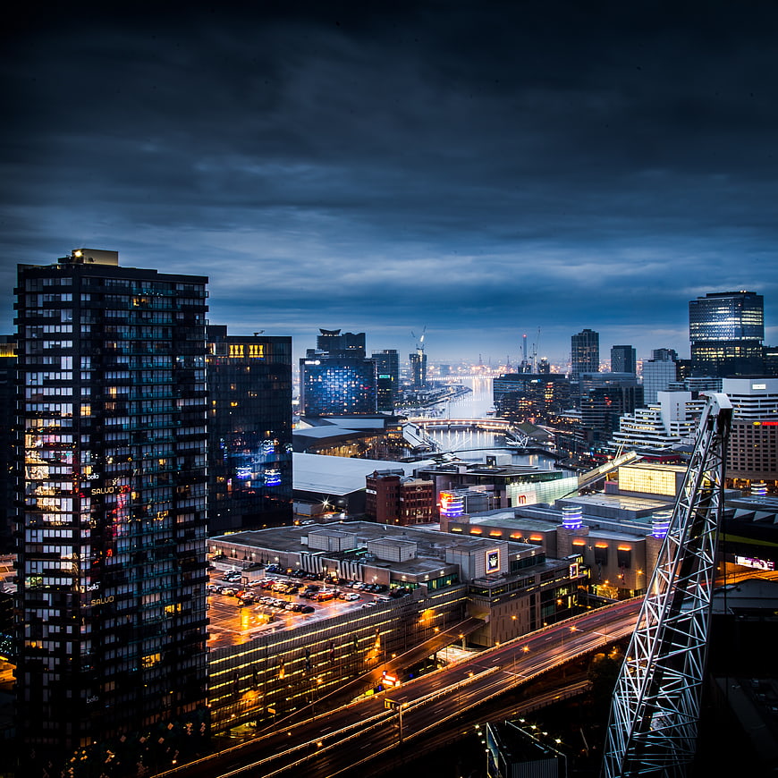 Dramatic Night Cityscape with Long Exposure Traffic and Modern Architecture