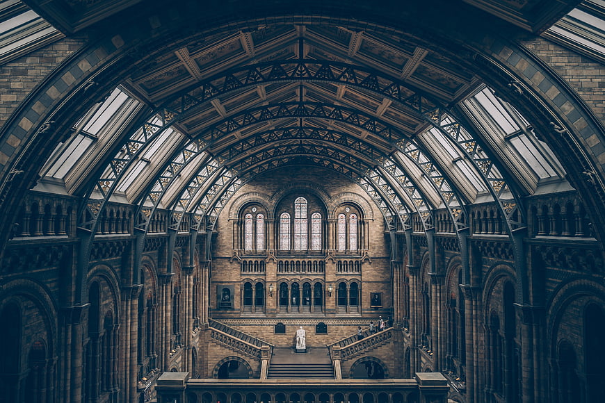 Symmetrical Victorian Museum Hall Interior with Arched Ceiling