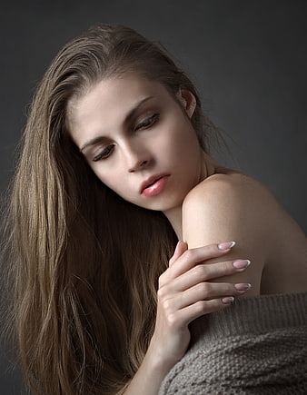 Melancholic Portrait of Young Woman with Long Hair