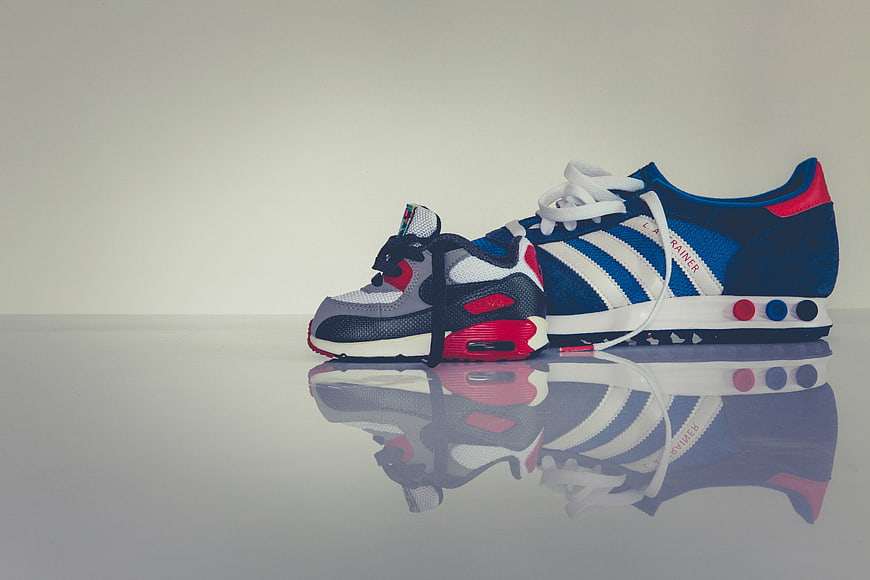 Blue and White Sneakers with Reflection on White Background