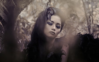 Dark Fantasy Portrait of Woman with Dramatic Makeup and Floral Hairpiece