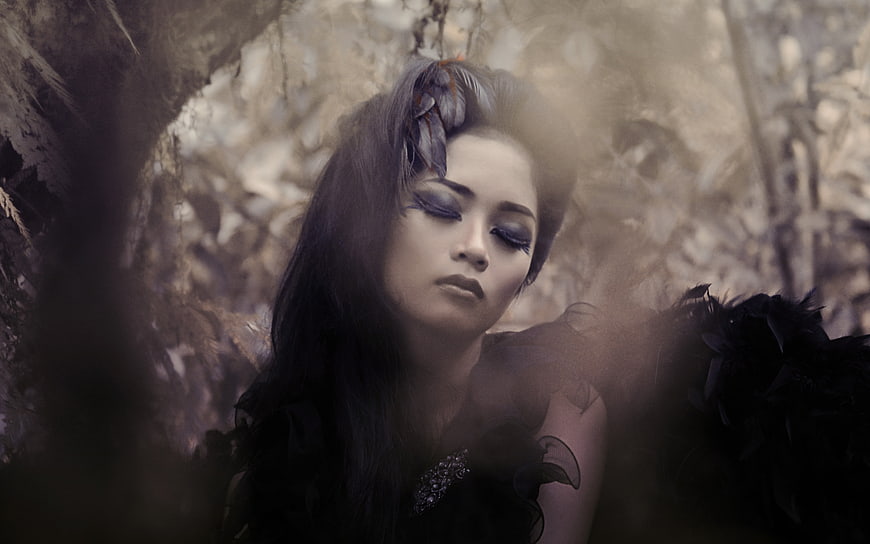 Dark Fantasy Portrait of Woman with Dramatic Makeup and Floral Hairpiece