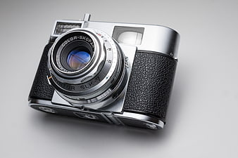 Vintage Rollei SLK-V Film Camera on Gray Background