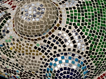 Colorful mosaic tile pattern on curved architectural surface