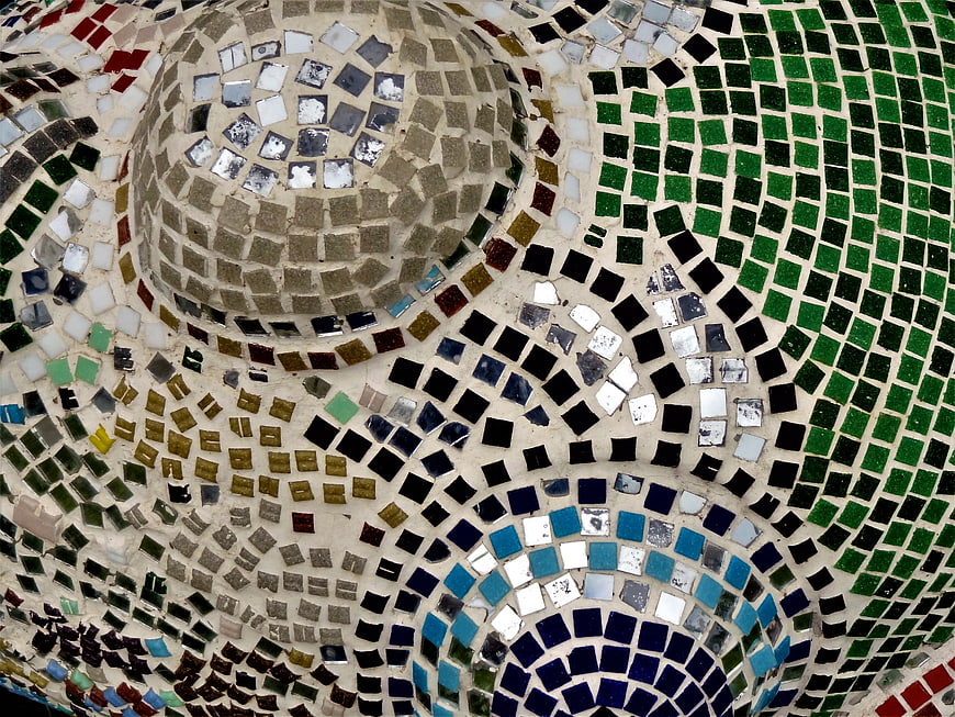 Colorful mosaic tile pattern on curved architectural surface