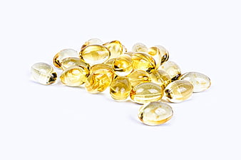 Yellow Fish Oil Capsules Isolated on White Background