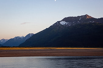 Scenic Alaska Mountain Landscape with Moon and River
