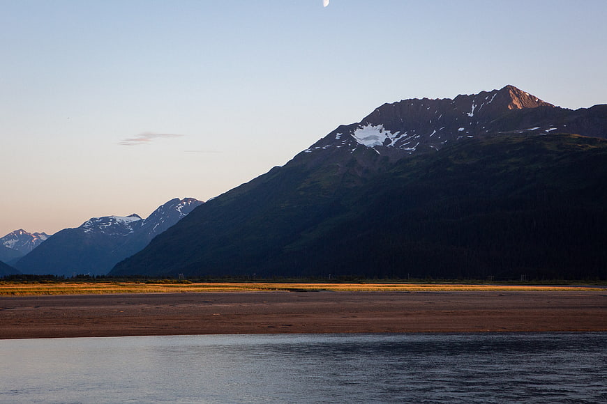 Scenic Alaska Mountain Landscape with Moon and River