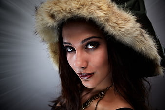 Portrait of Woman in Fur Hood with Dramatic Lighting
