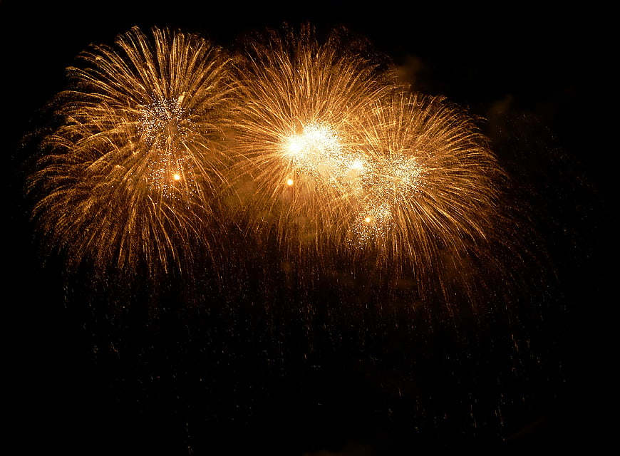 Golden Fireworks Exploding in Night Sky