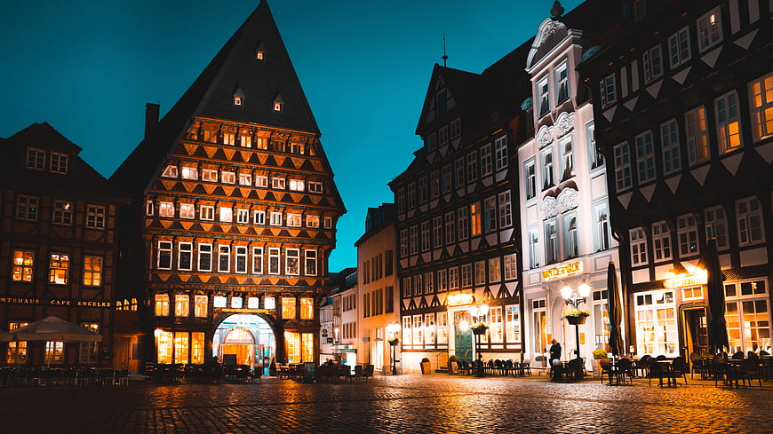 Historic half-timbered buildings in Hildesheim square at night