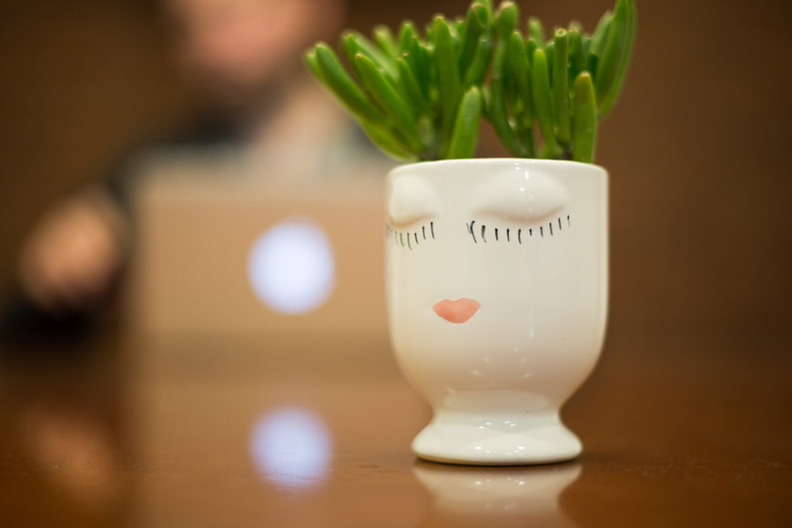 Cute Ceramic Face Vase with Succulent Plant on Desk