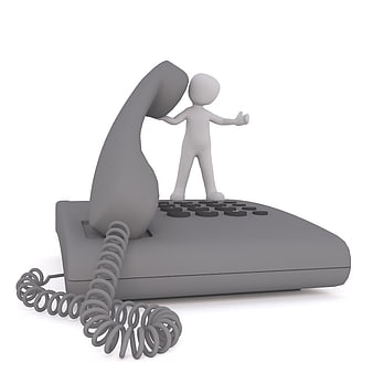 3D Character Talking on Giant Grey Telephone