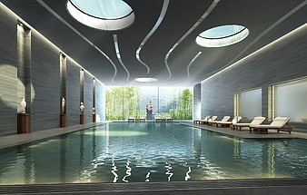 Luxurious indoor swimming pool with skylights and bamboo garden view